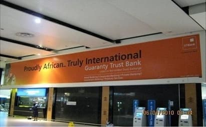Fidelity Bank *770# roadside wall and kiosk branding in Lagos.